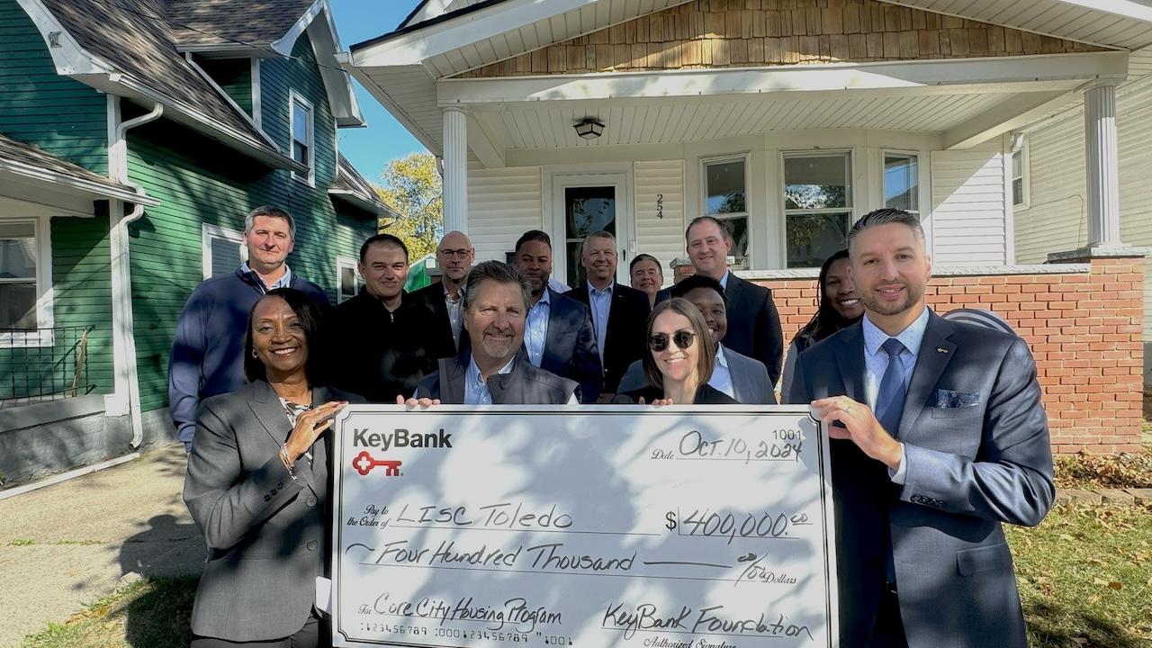 KeyBank and LISC Toledo representatives shown with a $400,000. grant check.