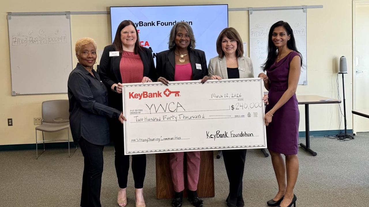 KeyBank and YWCA leadership shown with the grant check.