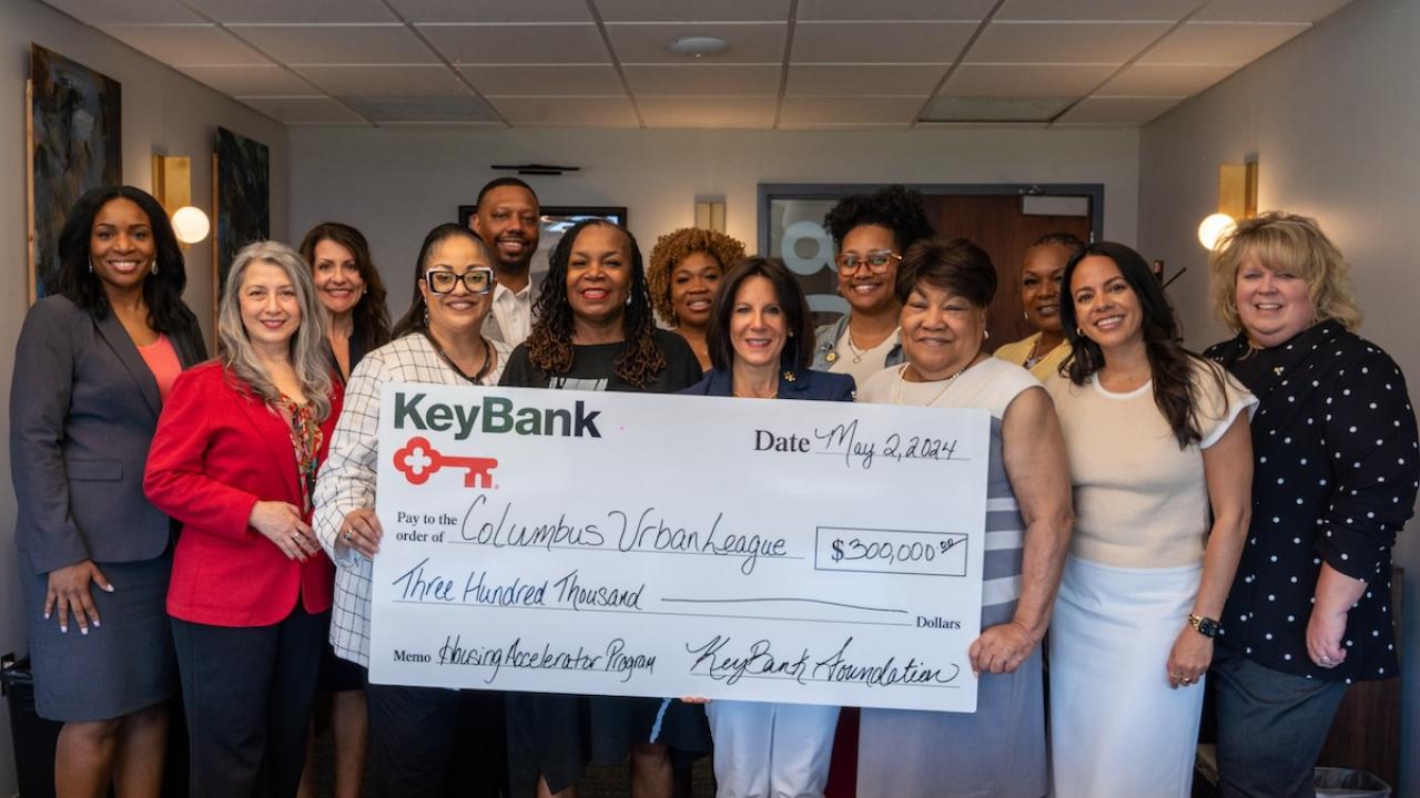 The Columbus Urban League and KeyBank representatives shown with a $300,000 grant check.