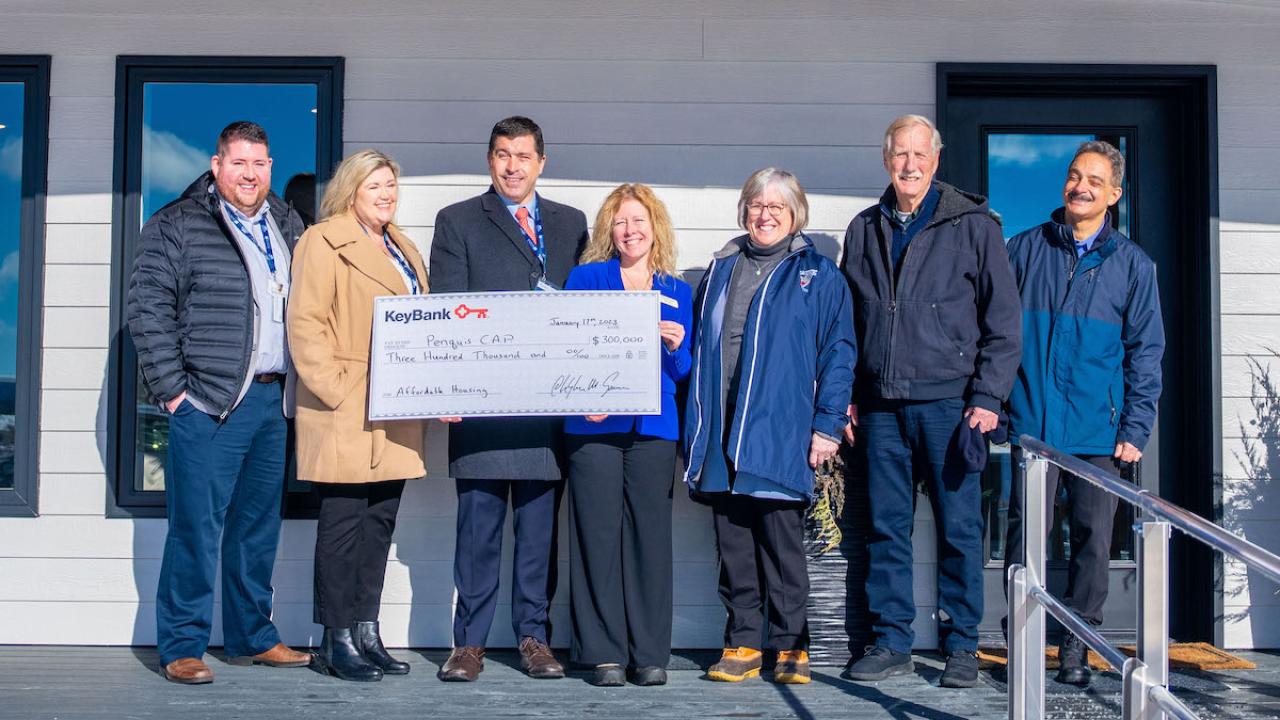 KeyBank and Penquis with grant check.