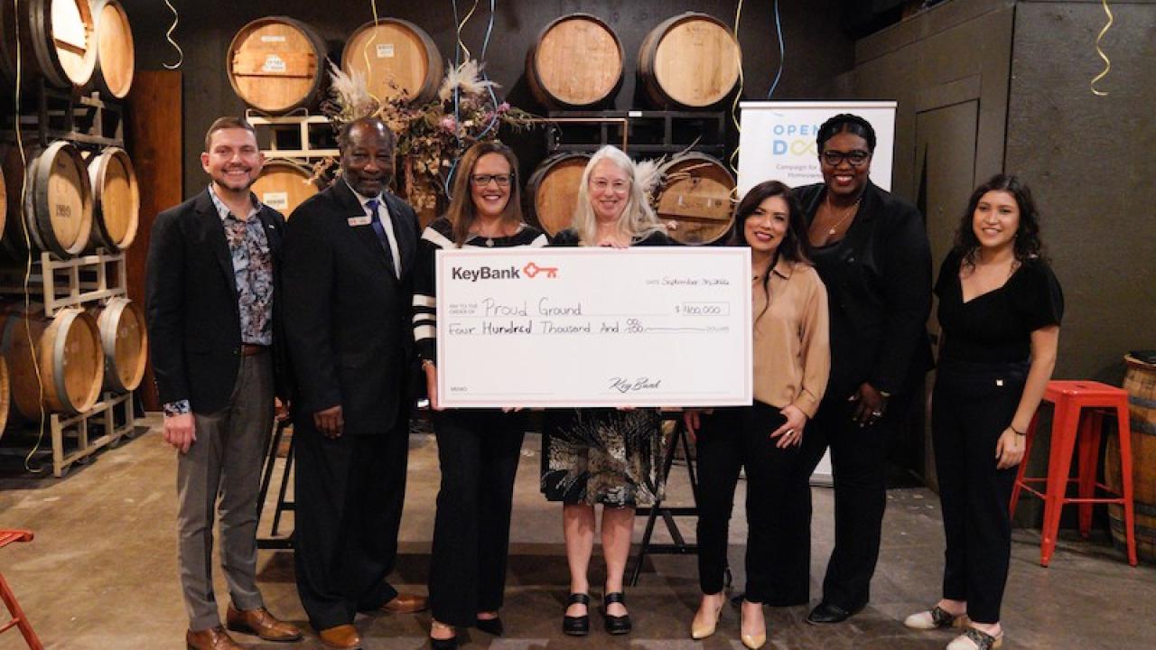 KeyBank and Proud Ground Team shown with check for $400,000.