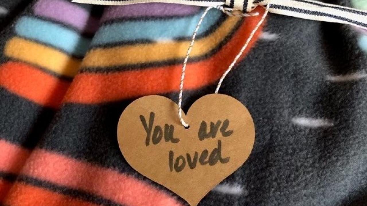 Words and Warmth blanket: Hear with "You are loved" shown.