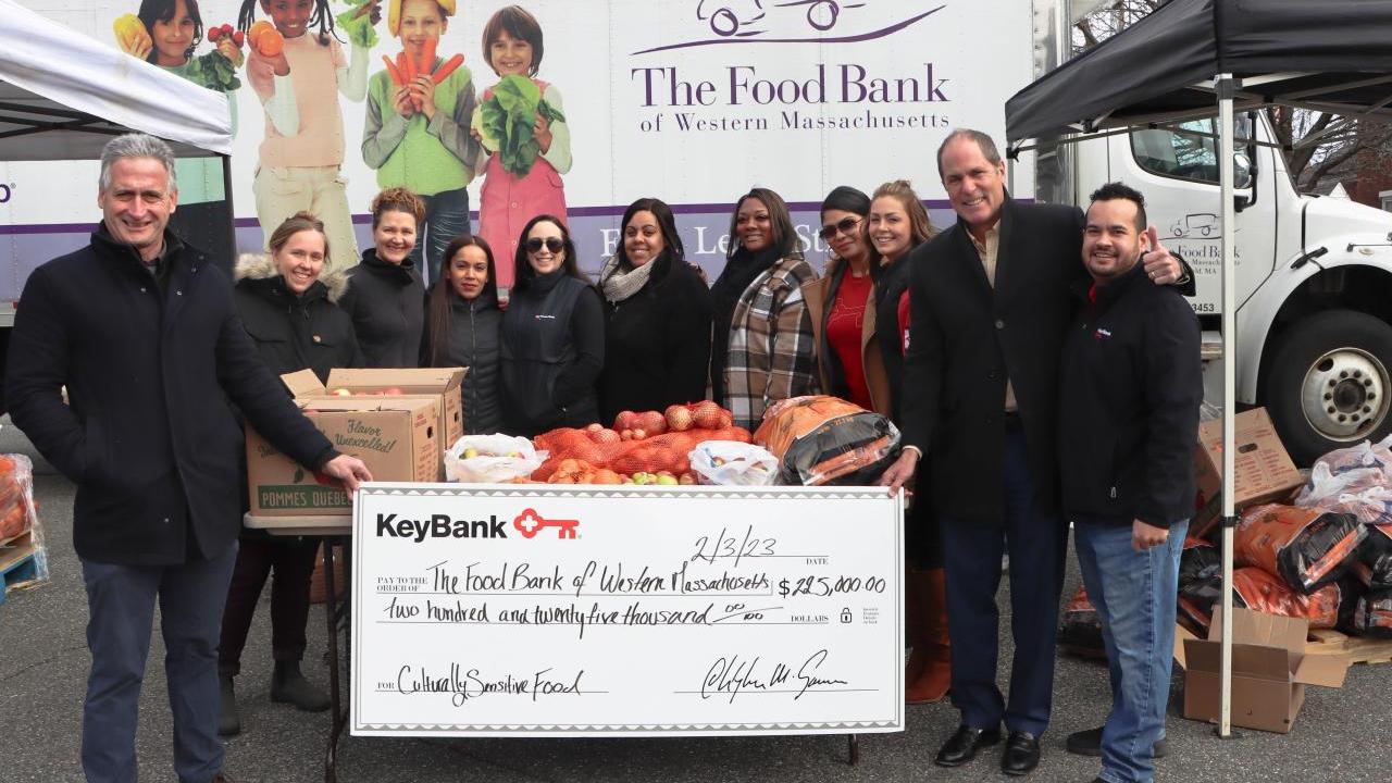 KeyBank and The Food Bank volunteers shown with check.