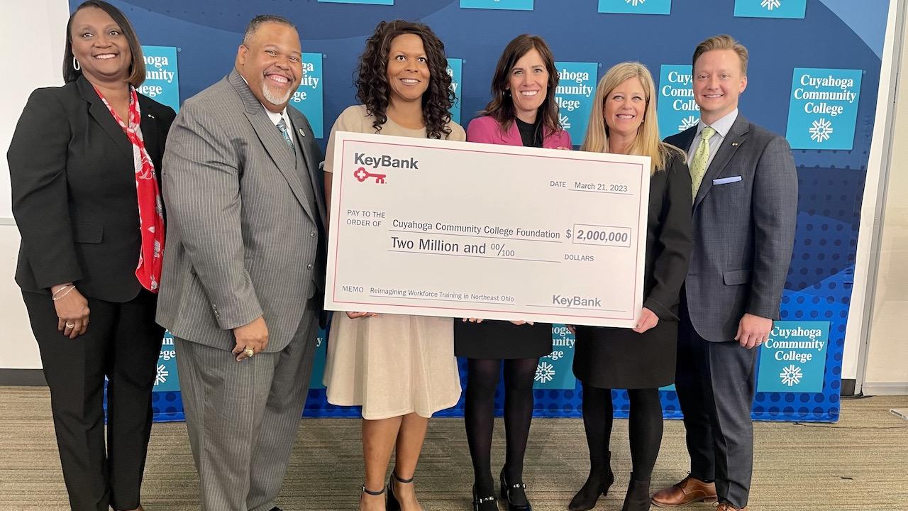 KeyBank and Tri-C Foundation team with grant check.
