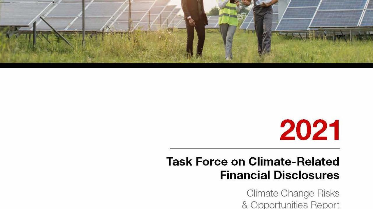 Solar panel array shown with three people. 2021 Task Force on Climate Related Financial Disclosures.