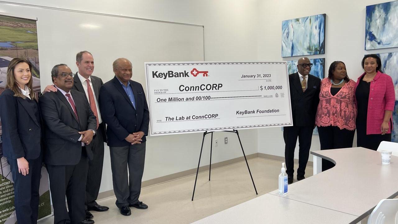 KeyBank and CONNCorp with Grant check.