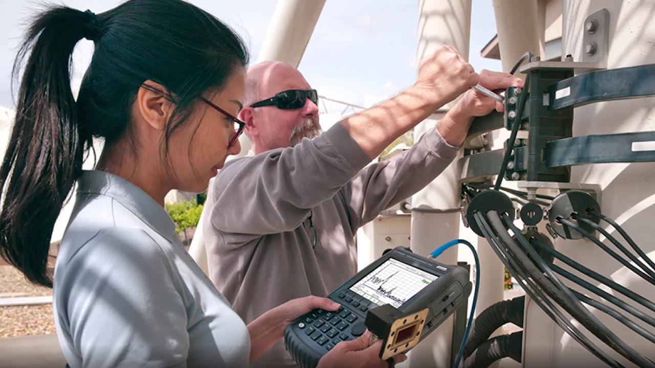 Man and woman working with Keysight Technologies equipment
