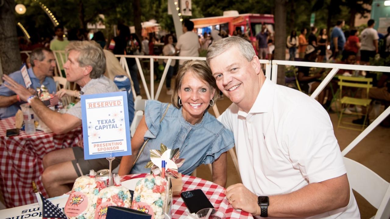Two people sitting together at a table