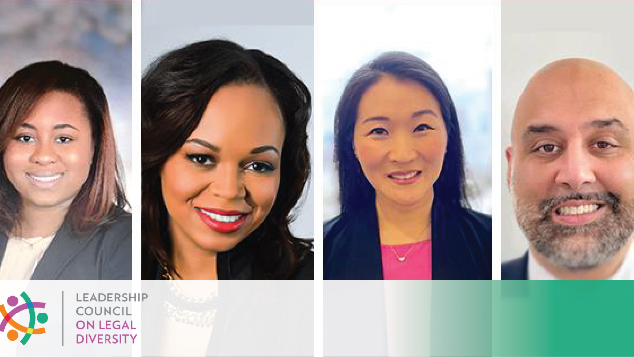 Headshots of four people smiling
