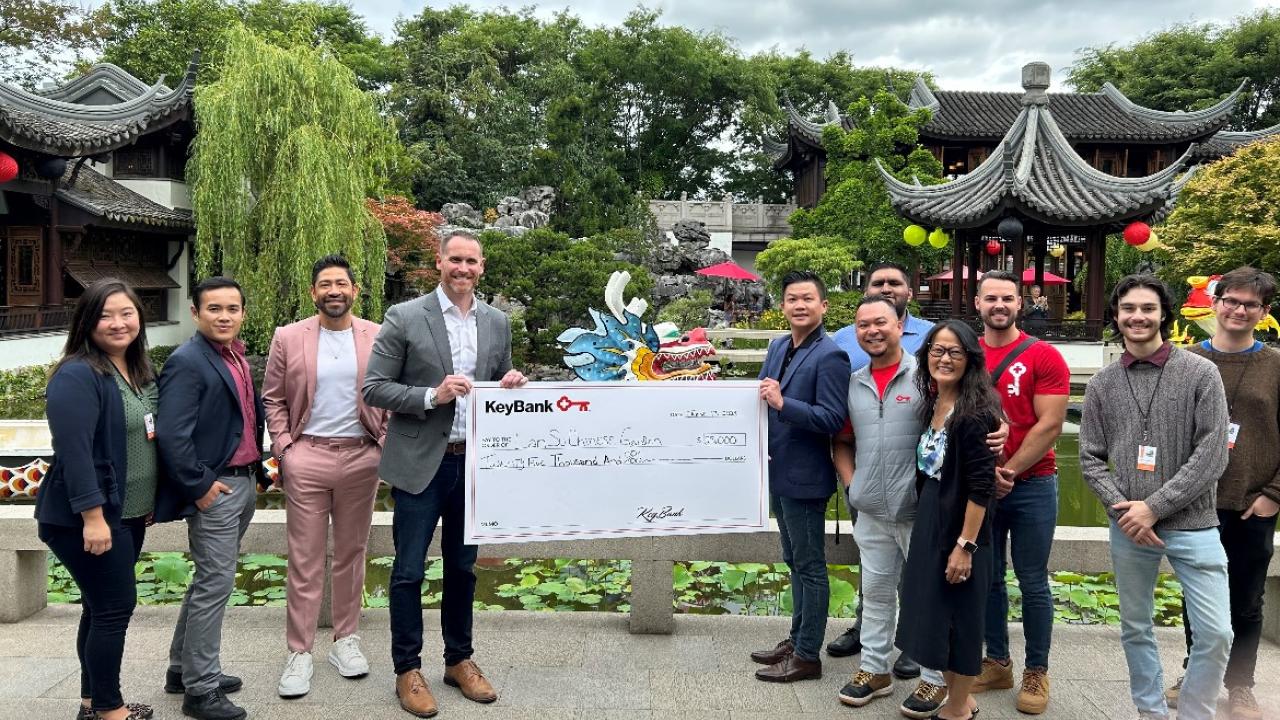 KeyBank and Lan Su teams accepting the grant check for $25,000. 