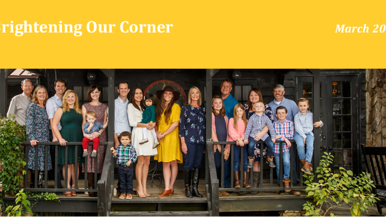 Group of people standing on a porch reads: Brightening our chapter March 2022