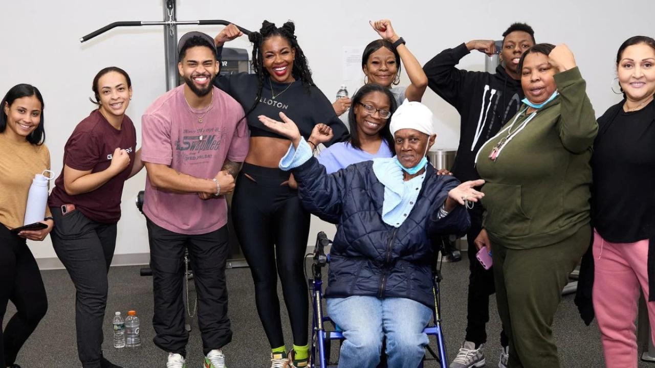A group of people flexing muscles