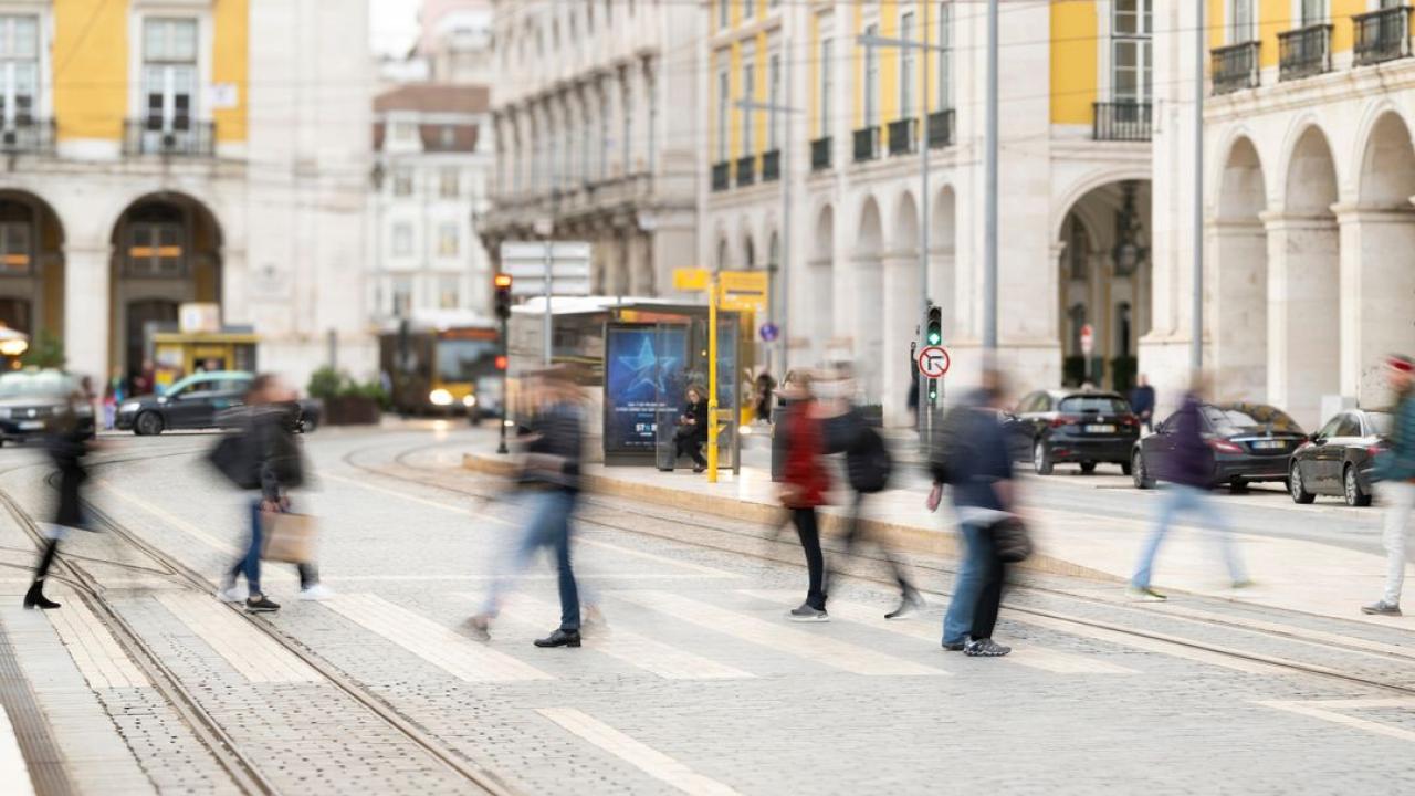 People walking across a street