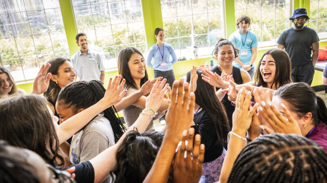 Live Más Scholarship recipients high fiving