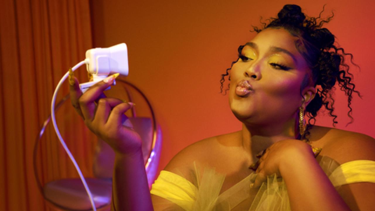 Lizzo recording herself on camera