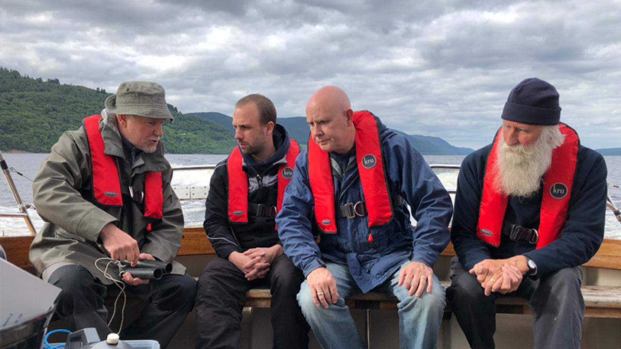 Eric Verspoor, Gert-Jan Jeunen, Neil Gemmell, and Adrian Shine aboard the boat Deepscan on Loch Ness. | Photo by Neil Gemmell