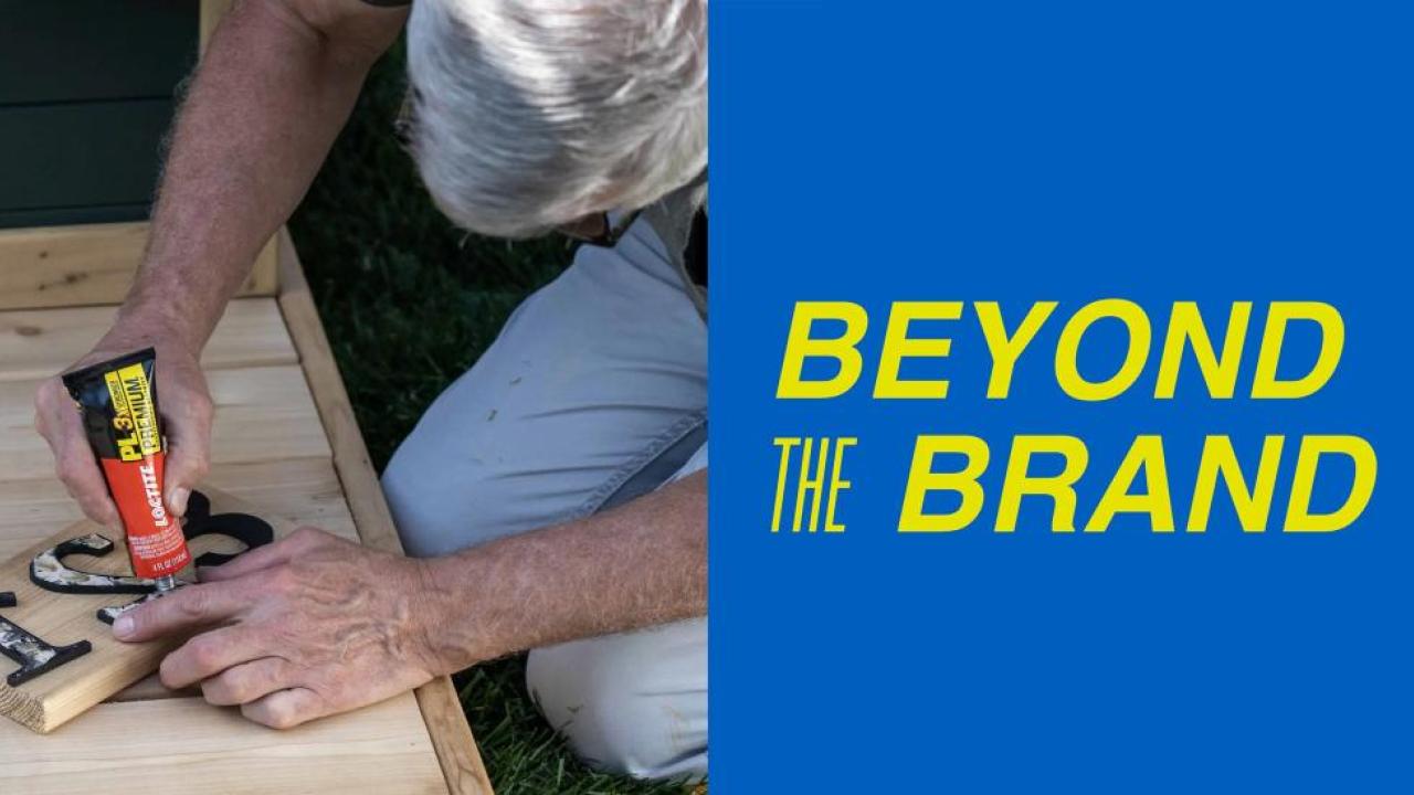 "Beyond the Brand" next to picture of a person's hands using Loctite® to glue a house number onto a wooden board