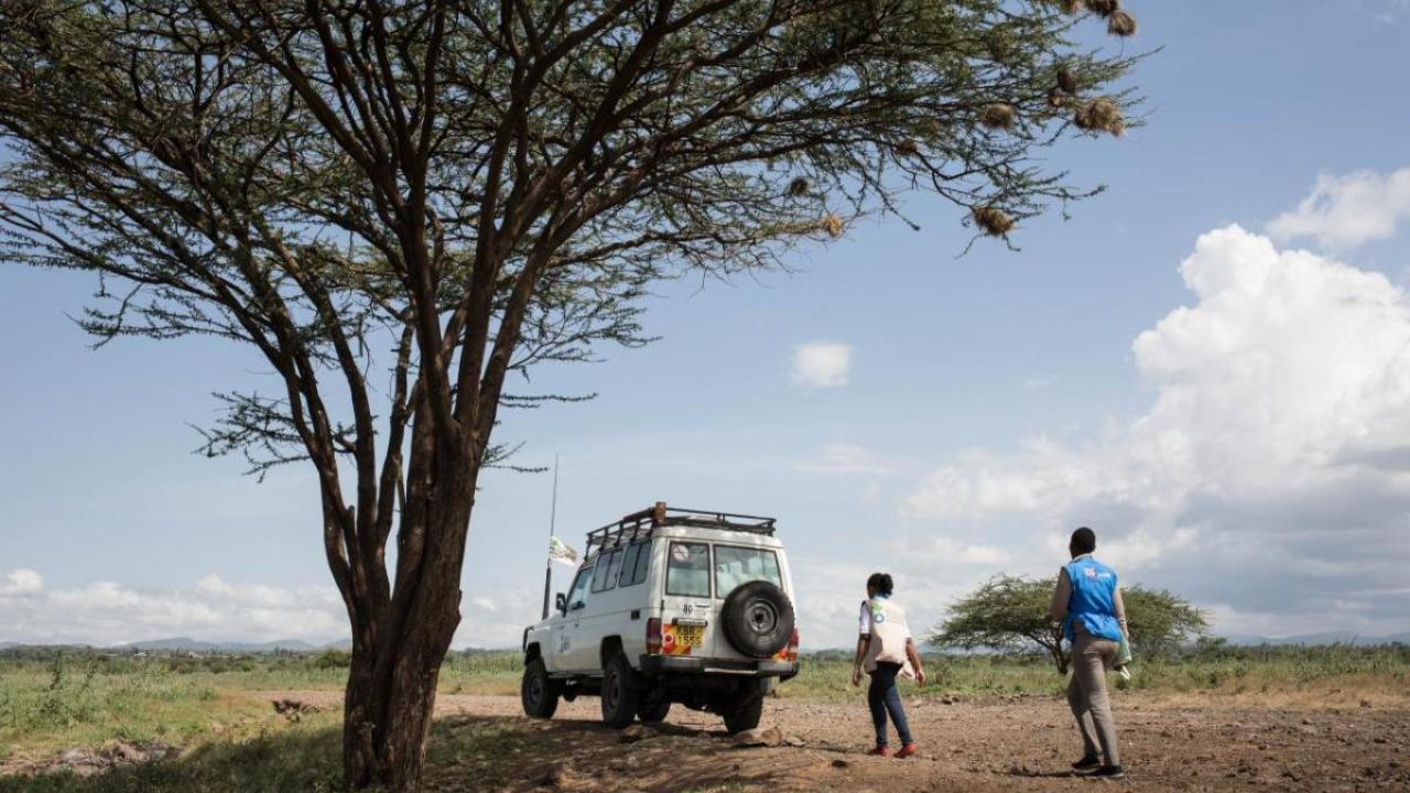 Magdalene, community health volunteer, and Leah, nutrition project officer of Action Against Hunger, walk towards the houses of the Turkana tribe to do nutrition screening to children under five in the rural area of Isiolo County