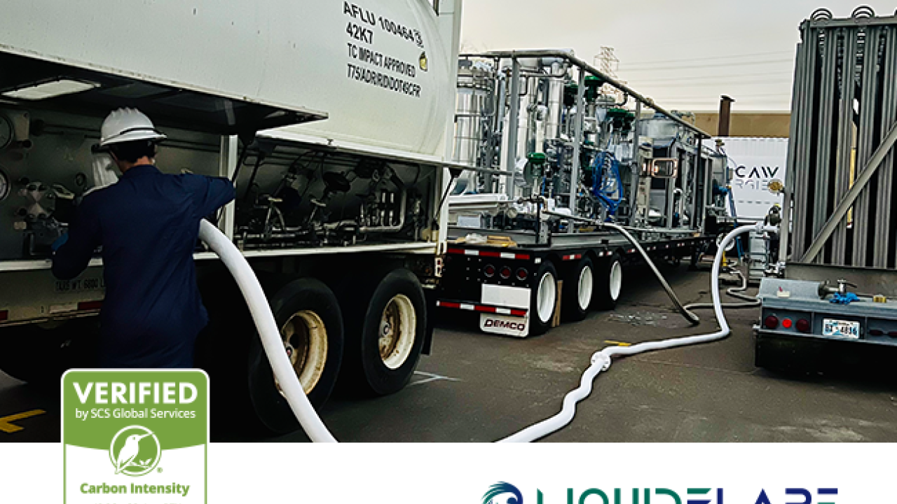 Trucks refueling from pipes with LIQUIDFLARE and SCS logos superimposed