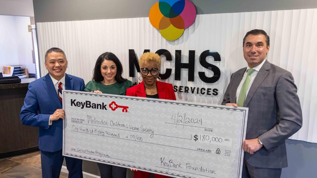 Team Members from MCHS and KeyBank shown with a $180,000 grant check.