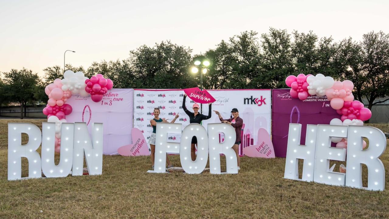 Sign reading "RUN FOR HER"