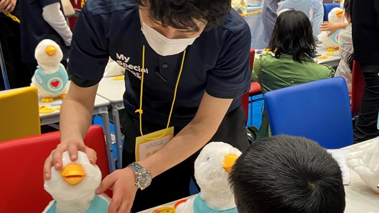 At the General Meeting of the Japan Medical Association, kids interact and play with social robot My Special Aflac Duck, which provides comfort and joy to kids with cancer and sickle cell disease.