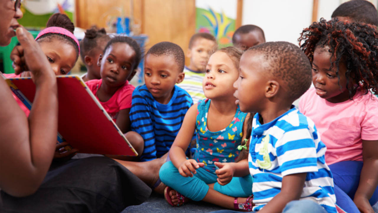 young children sitting together for story time