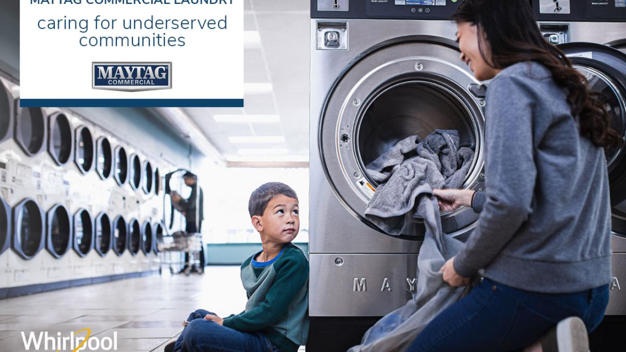 Mom and child doing laundry at a laundromat