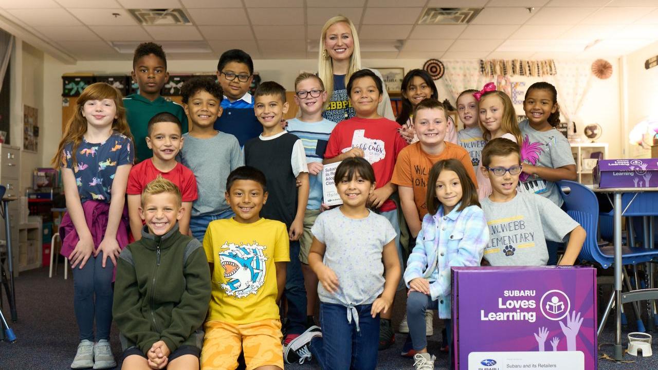 Group photo of students in a classroom