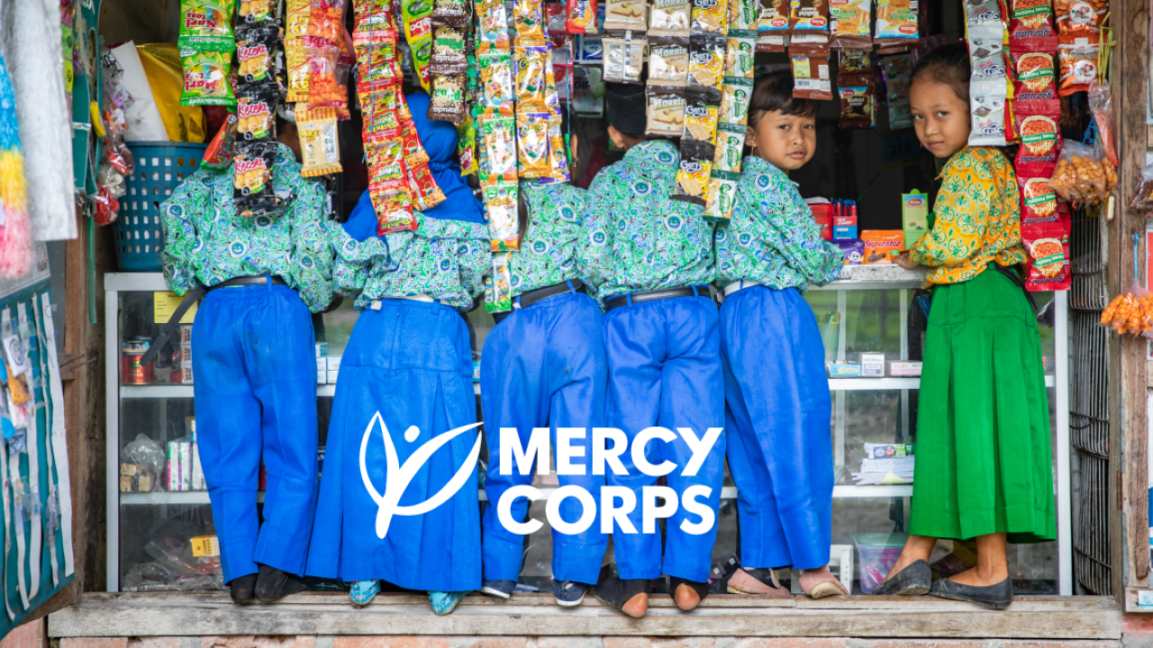group of children with the Mercy Corps logo superimposed