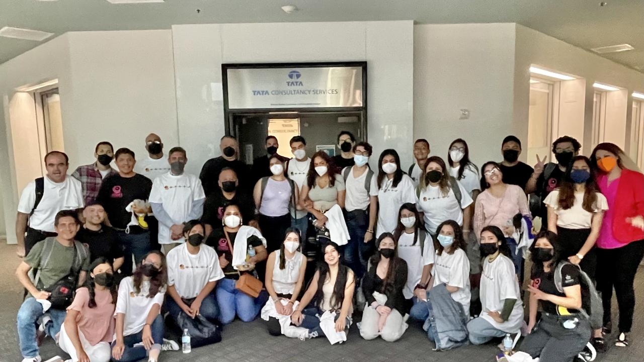 The group of 30 students pose for a photo
