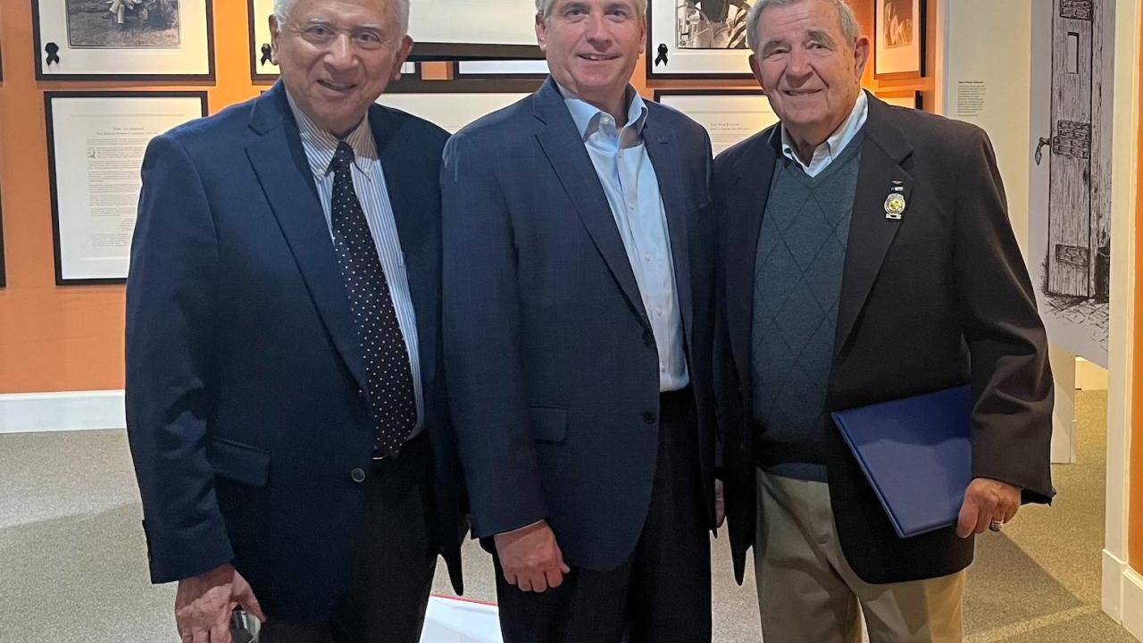 3 men standing together 