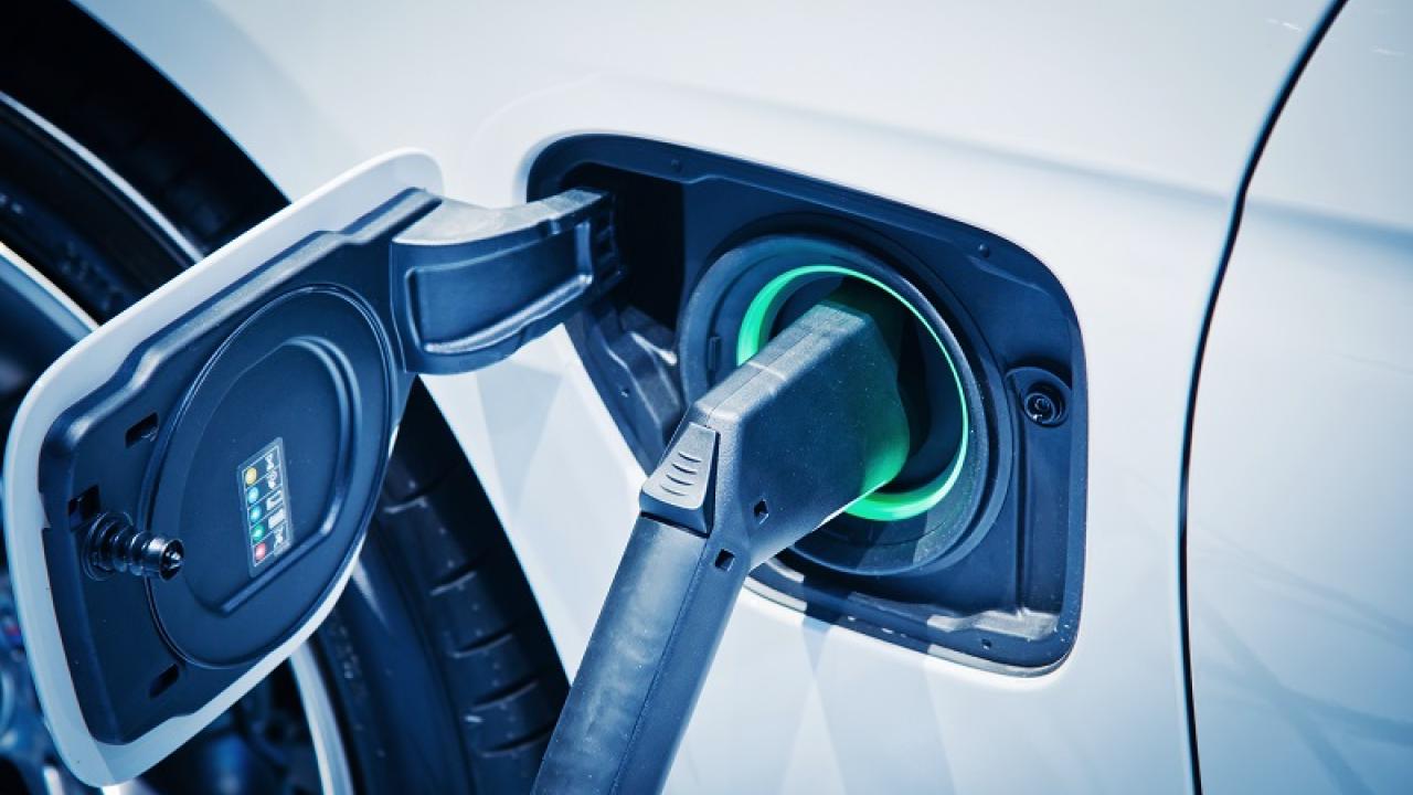 An electric vehicle being charged 