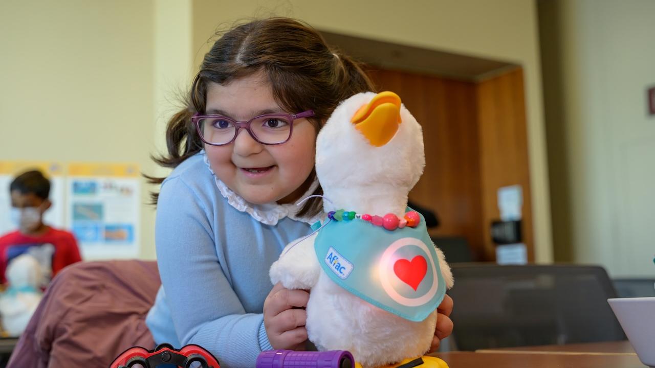 My Special Aflac Duck shown with a young Girl at Lurie Children's Hospital.