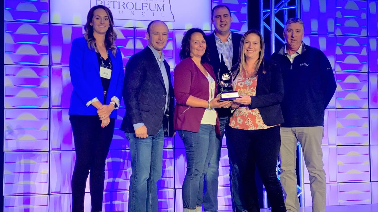 Marathon employees accepting award