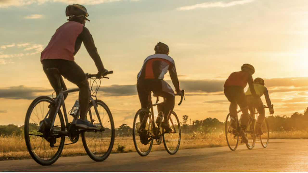 Bikers Riding into a sunset.