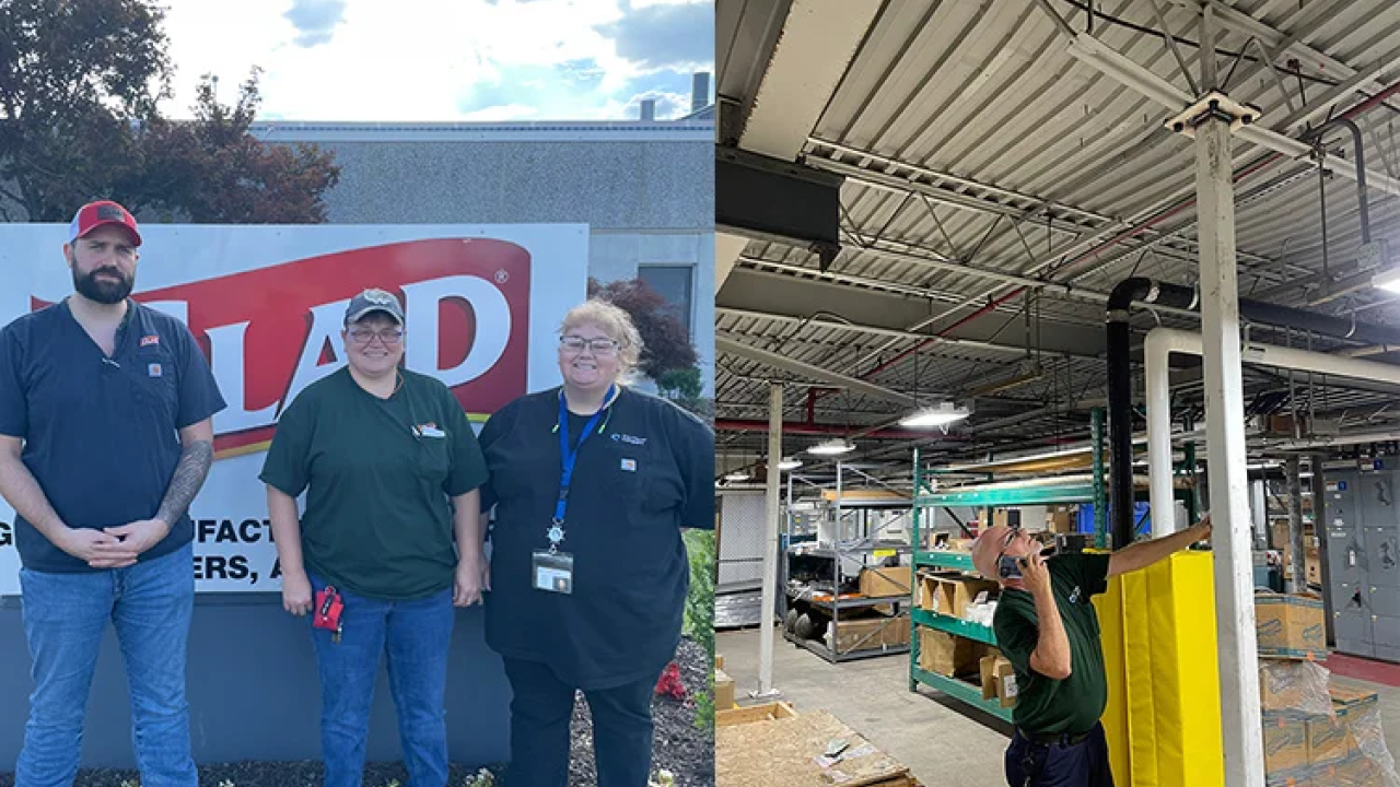 3 people stand in front of Glad factory