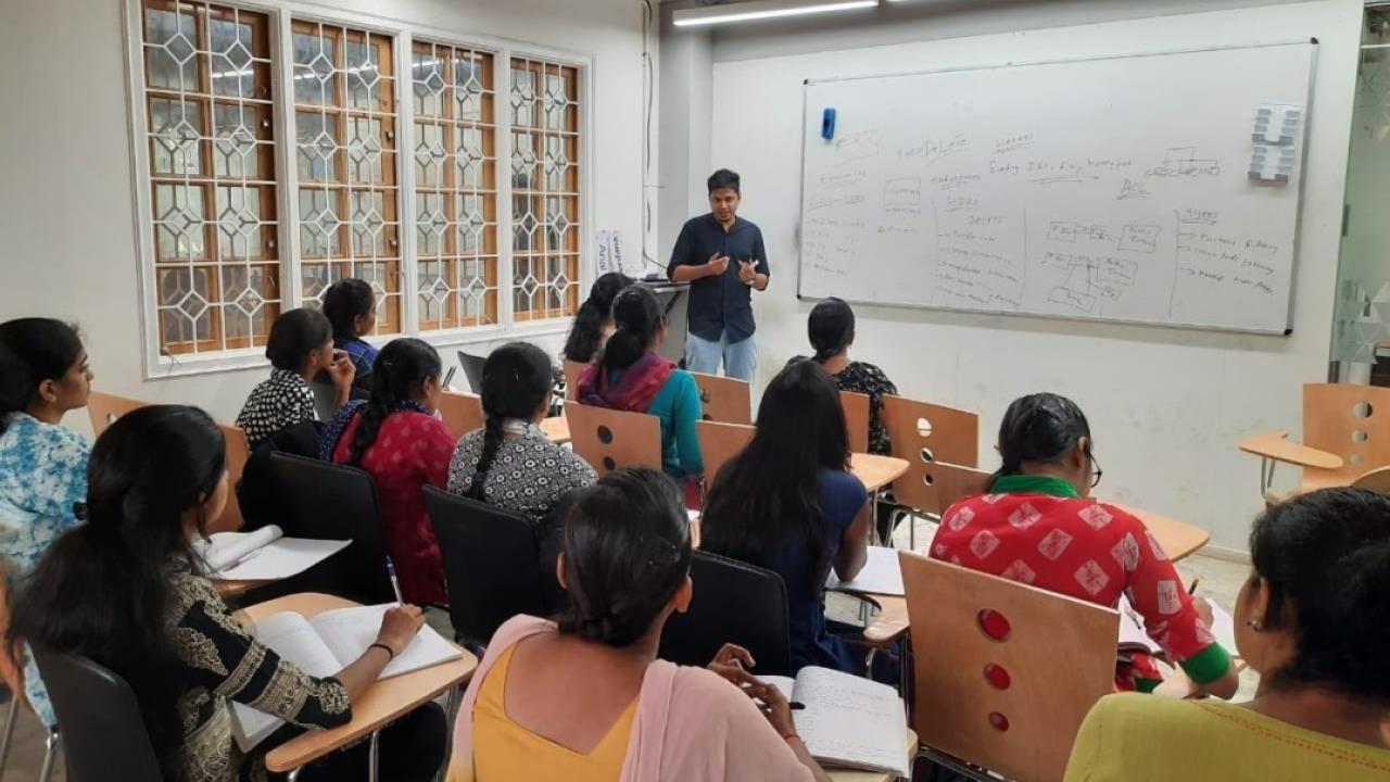 Classroom of women learning from instructor