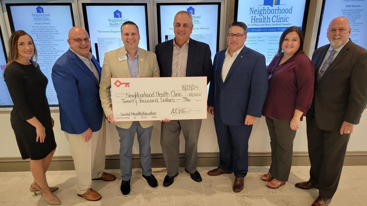Check presentation of $20,000 from KeyBank to Neighborhood Health Care.