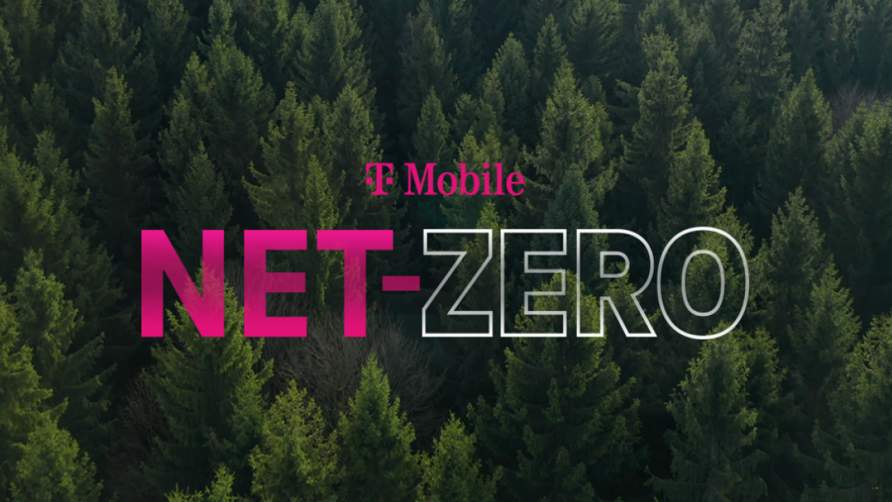 "T-Mobile NET-ZERO" centered in pink and white lettering over a background of a dense pine tree forest.