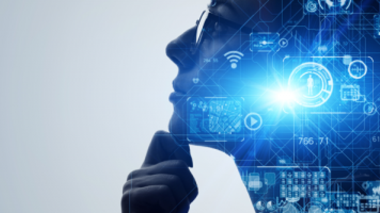 Silhouette of a person on a white background, blue symbols and tech drawings inside the silhouette.