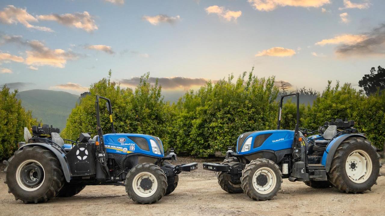 Two autonomous New Holland tractors 