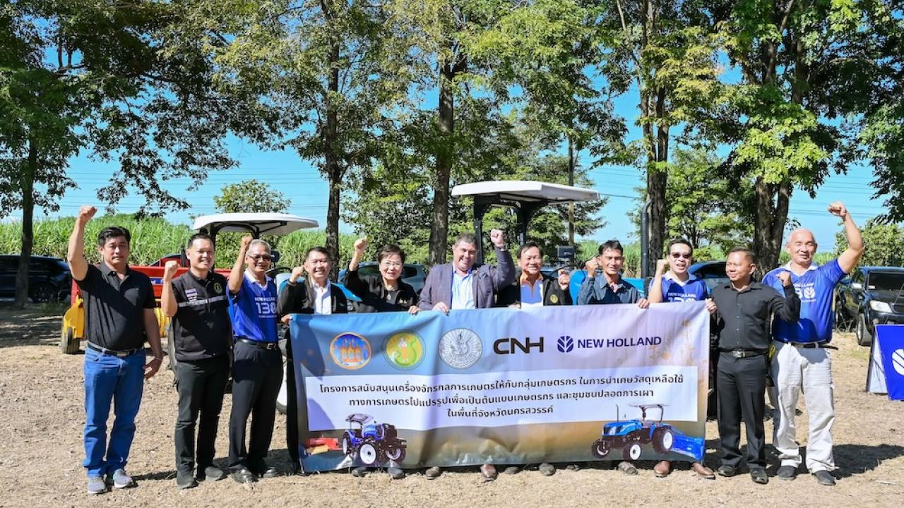 Group holding up a banner at New Holland Day celebration