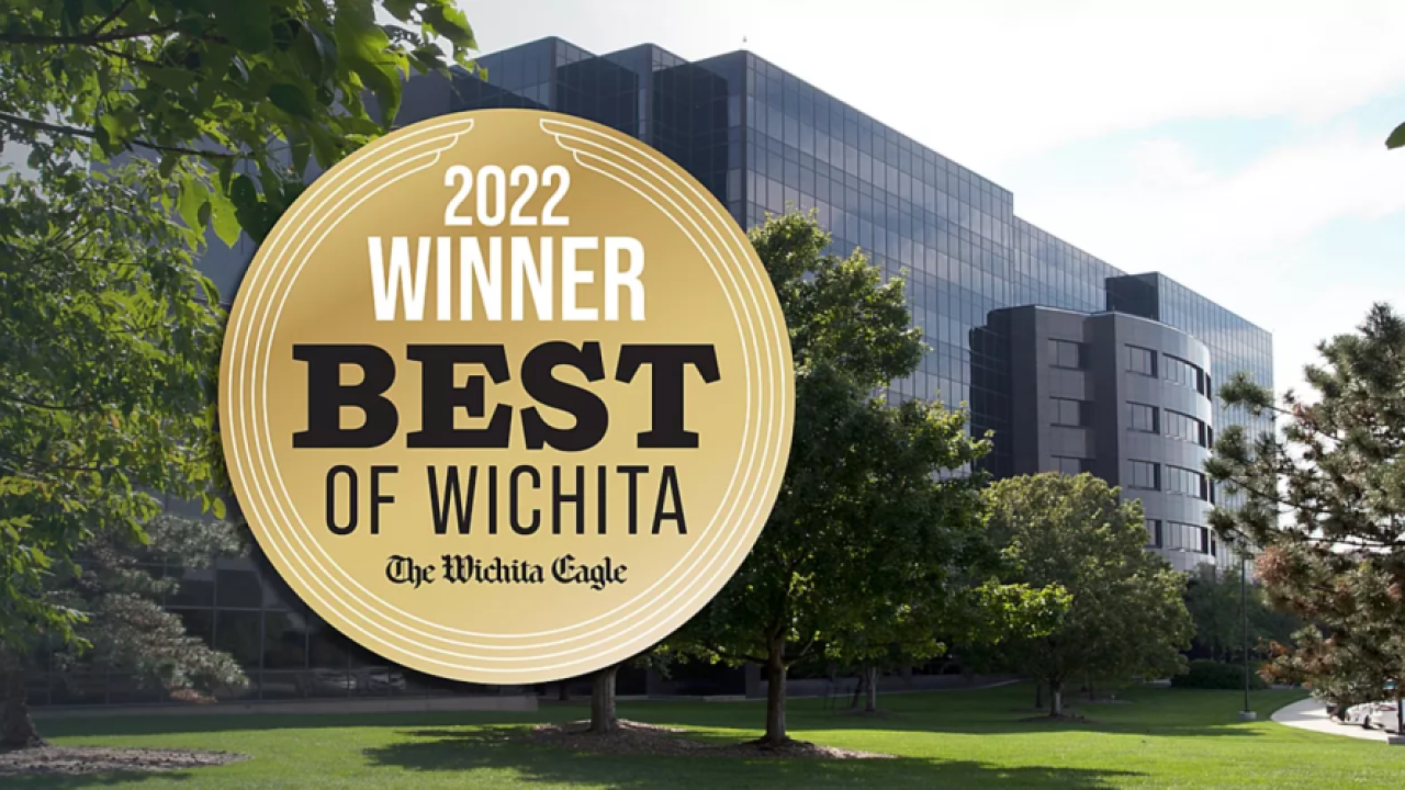 award with building and trees in background