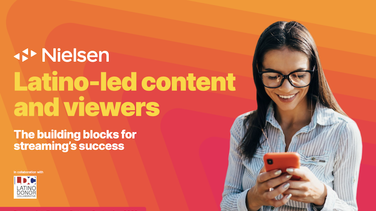 Person looking at a cell phone. On the left Nielsen logo and "Latino-led content and viewers. The building blocks for streaming's success"