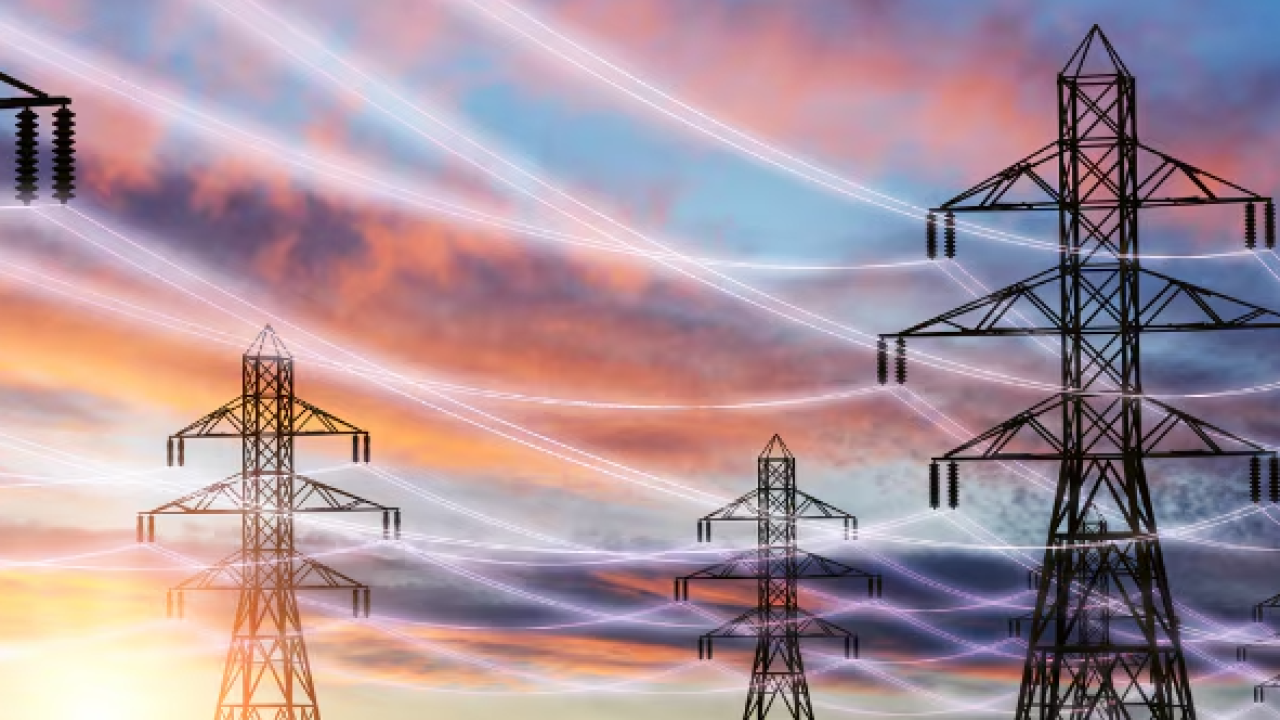 electric power transfer towers at sunset