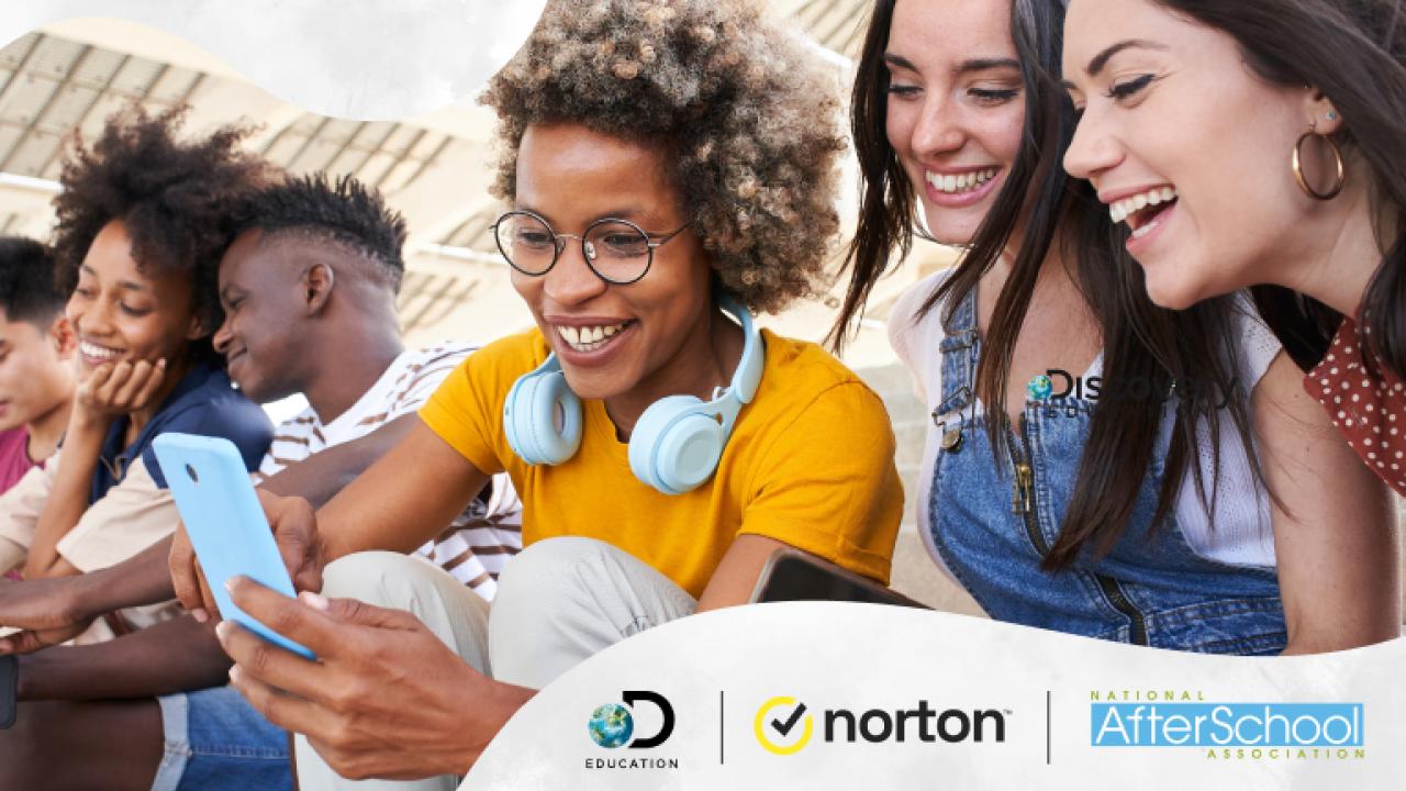 Young people looking at a cellphone