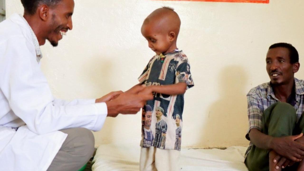 Nuredin, a staff member at the Action Against Hunger-supported health clinic, takes joy in helping Gebremedihin’s son recover.