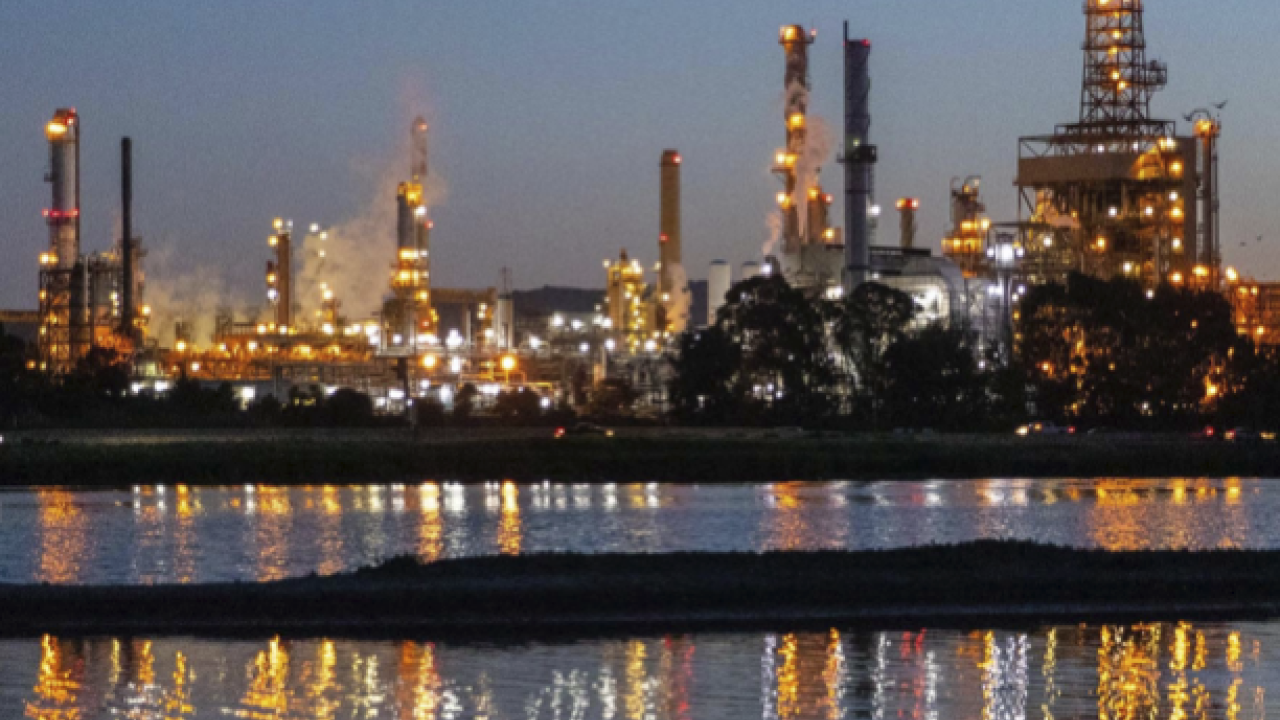Report cover showing refinery