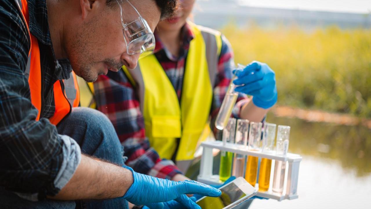 Field Workers Sampling Water